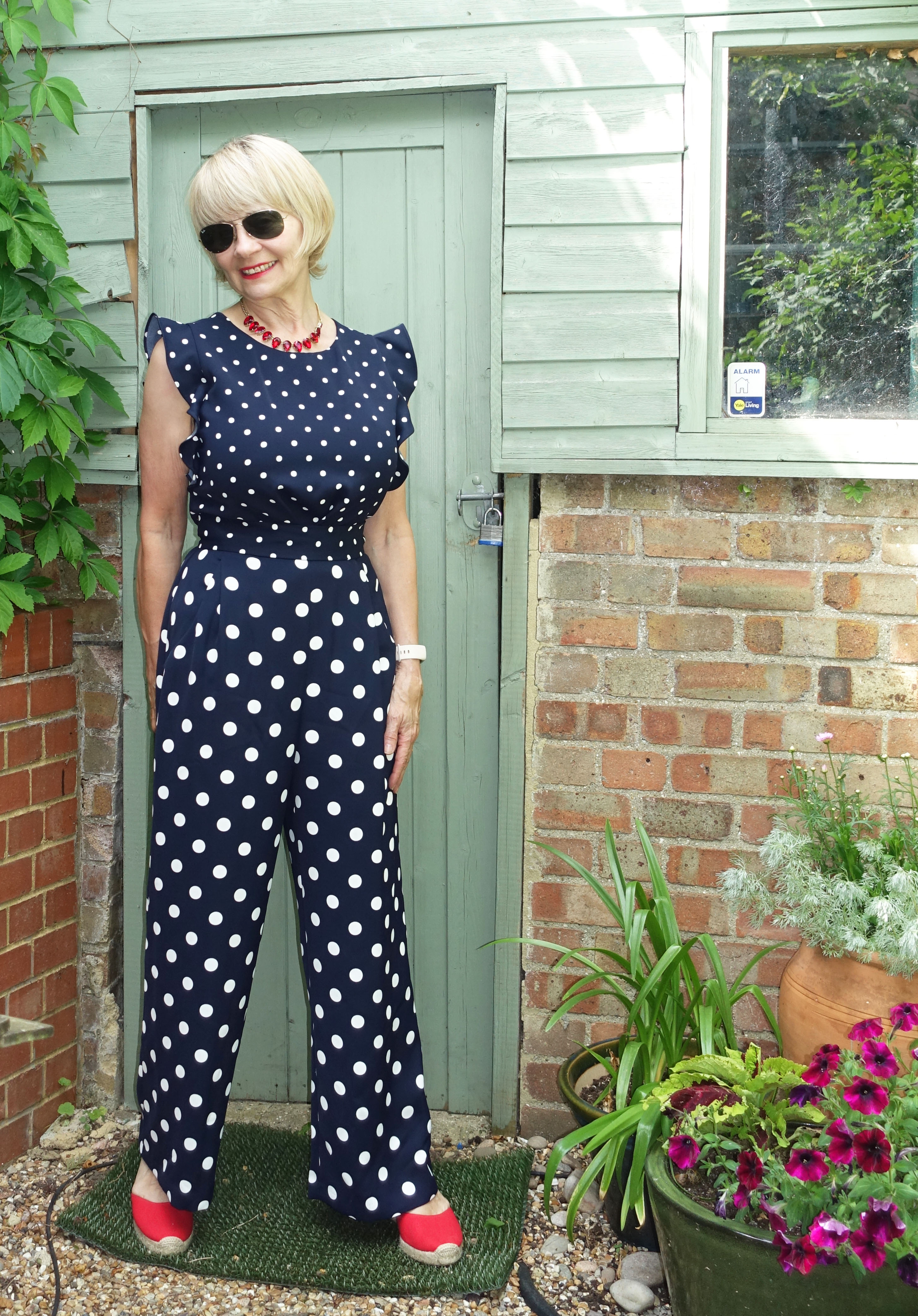 Over 60s blogger Gail Hanlon in navy and white polka dot jumpsuit