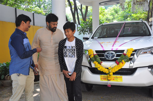 Megastar Chiranjeevi & Suresh Kondeti with his New Fortuner Car Pooja Picture