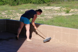 Sweeping up the dust on the balcony