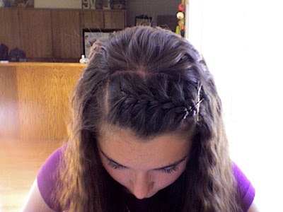 in the middle and pulled backside and pinned up by making French braid.