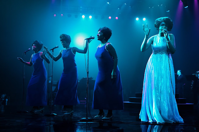 Four ladies sing on stage