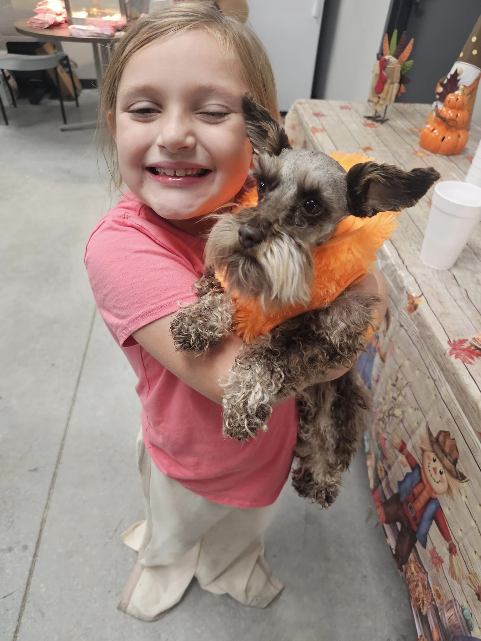 girl holding a dog