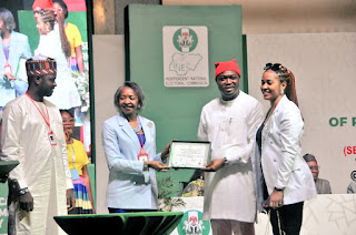 Chairman of the Independent National Electoral Commission (INEC), Prof. Mahmood Yakubu, presents Certificate of Return to House of Representatives-elect