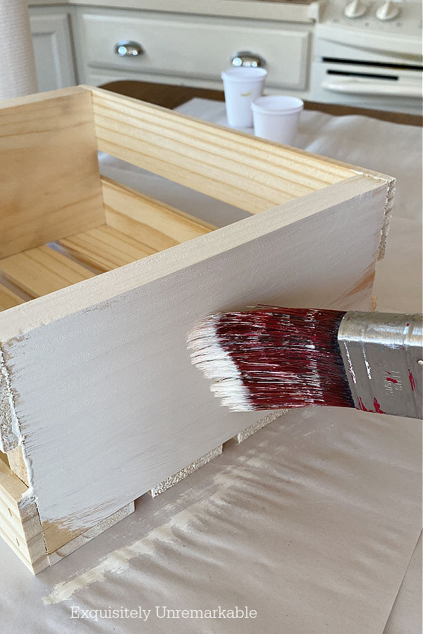 Painting An Unfinished Crate with cream chalk paint