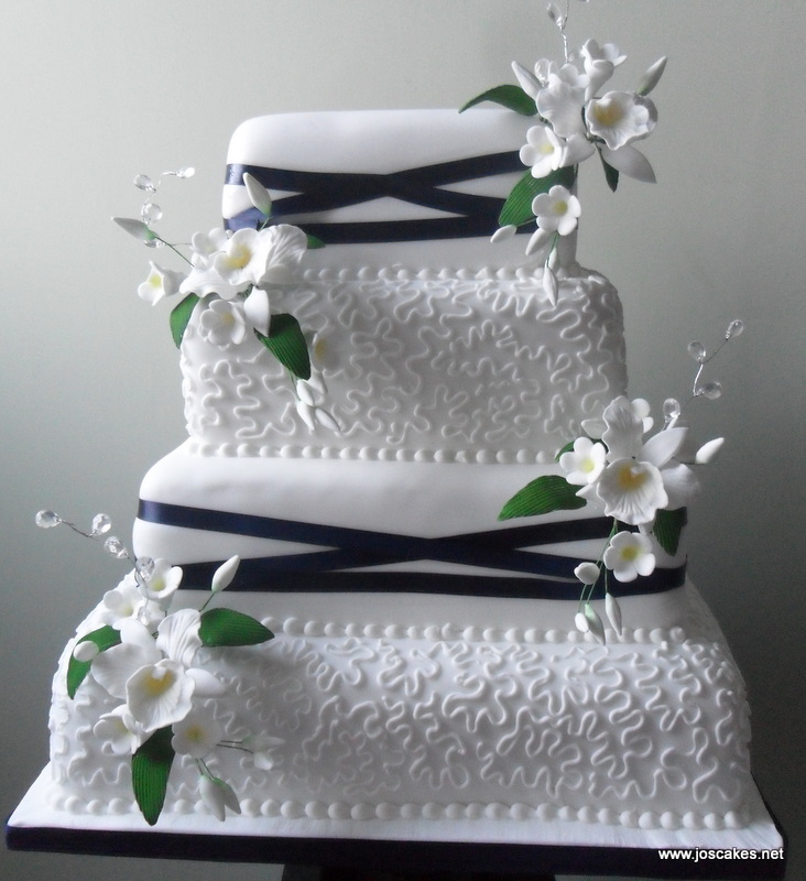 Four Tier Lace and Ribbons Wedding Cake