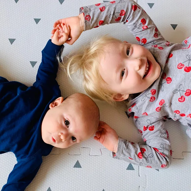 Siblings on Gus and Beau playmats