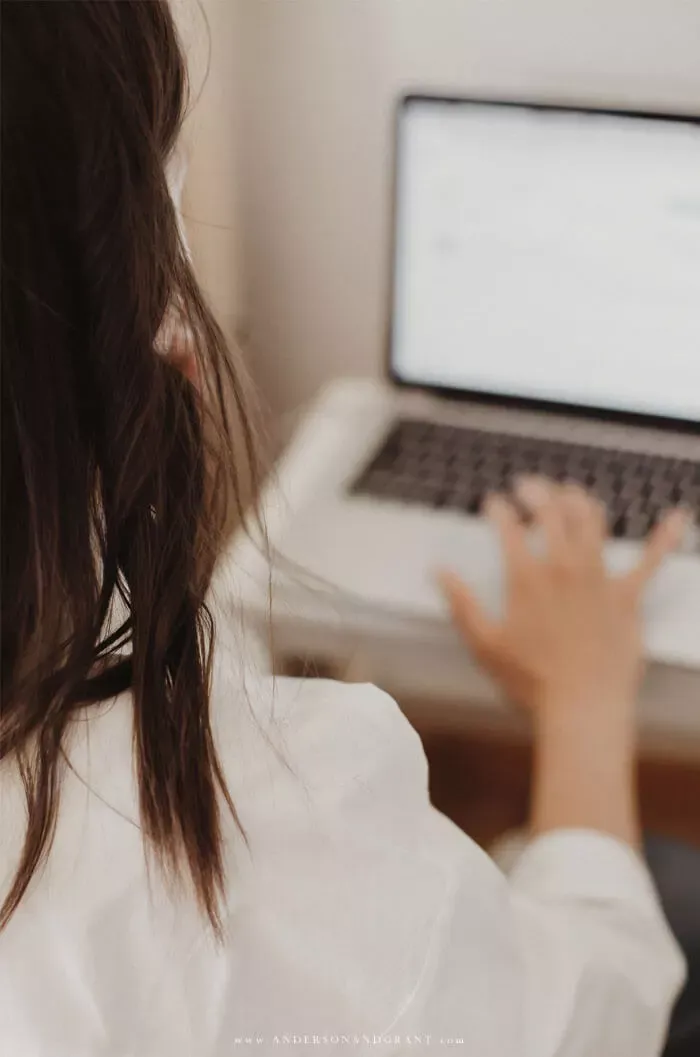 Brunette woman looking at computer