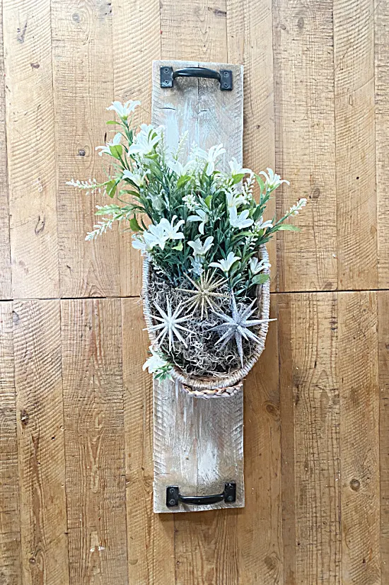 long centerpiece basket on wooden board on table