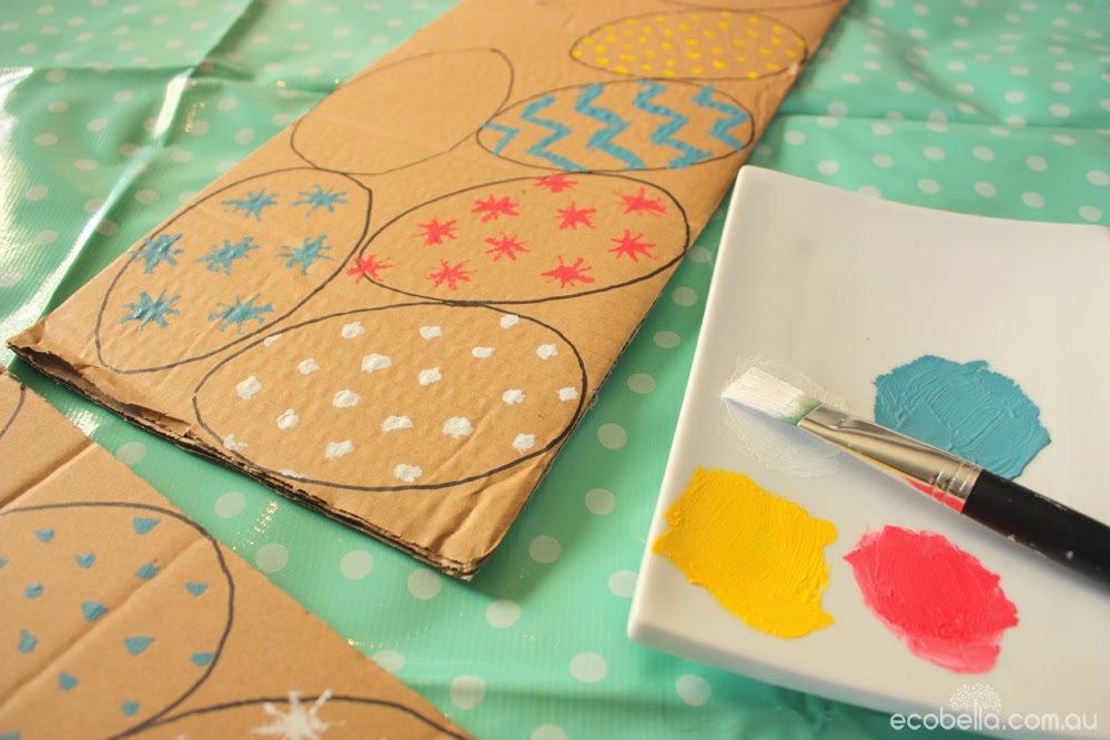 painting and decorating cardboard eggs for a chocolate free hunt