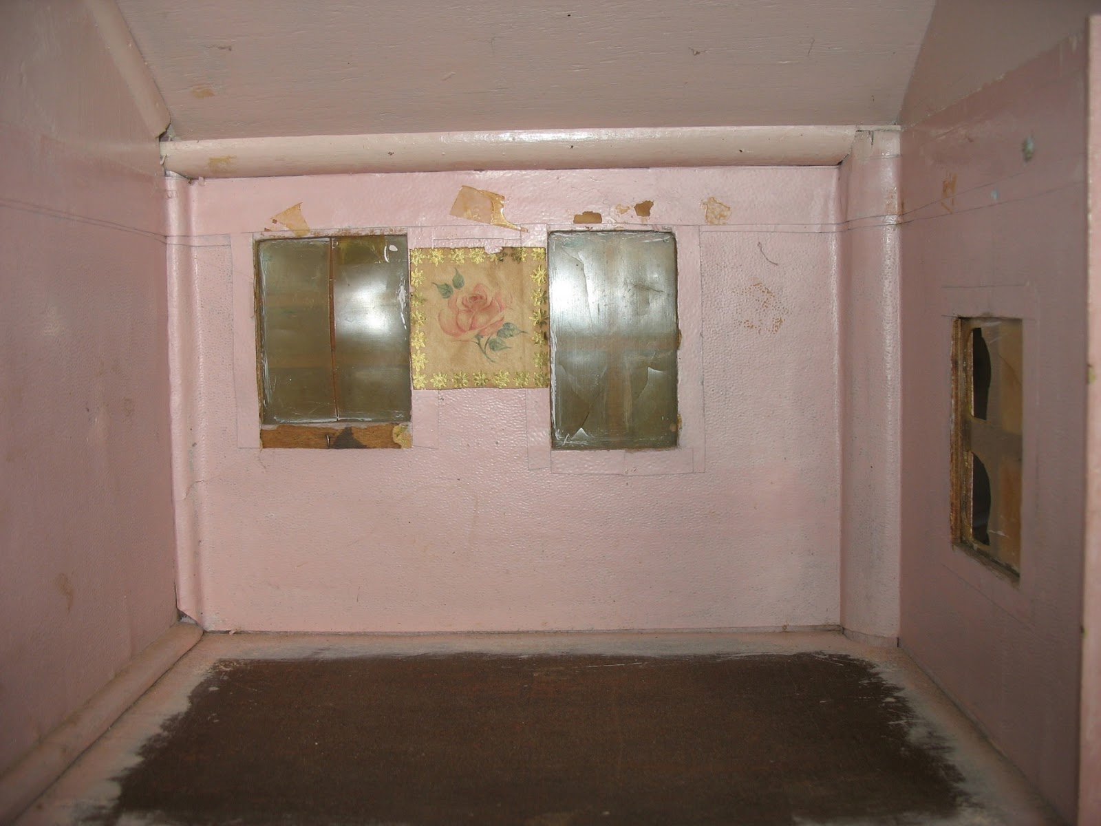 ... upstairs room have been painted pink, over the top of the wallpaper