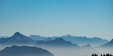 Rocky Mountains in Fog and Blue Sky