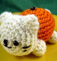 http://www.ravelry.com/patterns/library/tangerine--orange--clementine-amigurumi-cat