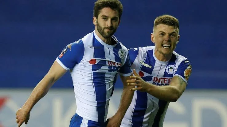 Angry Wigan players in talks to go on STRIKE over more unpaid wages