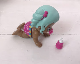 Bizzy Bubs crawling toy doll with pink bottle