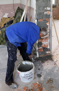 Sally slapping concrete in place