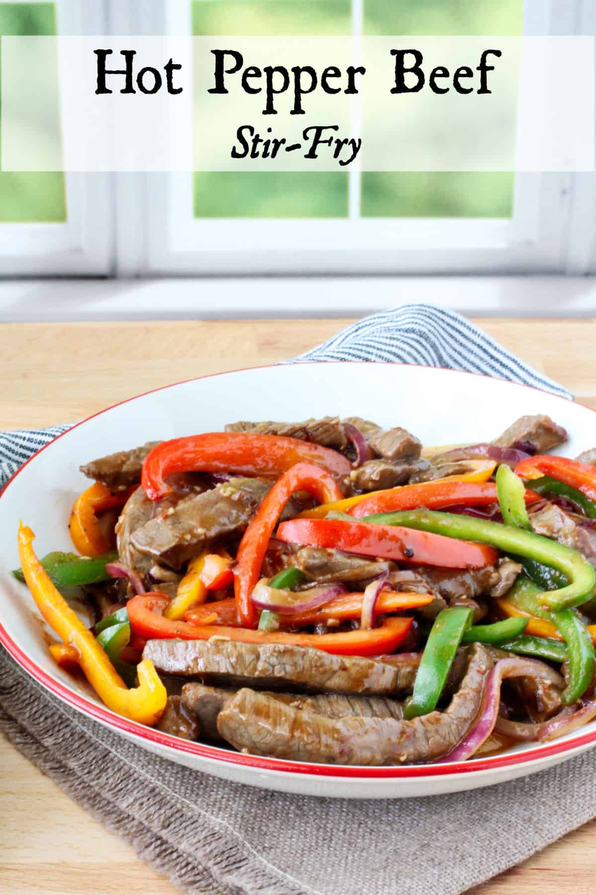 Hot Pepper Beef Stir-Fry in a red rimmed bowl.