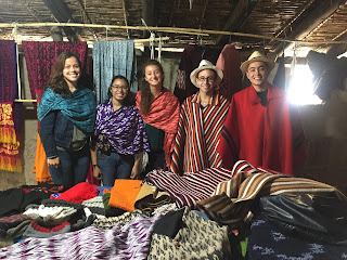 Five TEFL students at La Casa de la Makana, all dressed in traditional makana shawls or ponchos