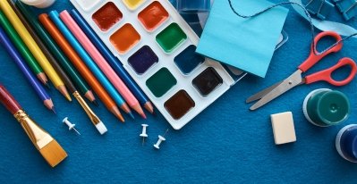 Craft supplies such as watercolors, colored pencils, paints, scissors, and more.