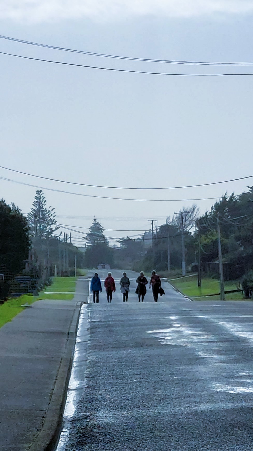 Ladies walking down a Waitārere Beach road