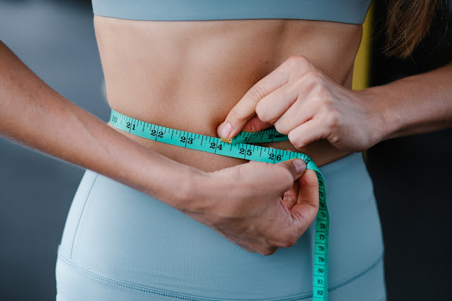 Woman measuring waist
