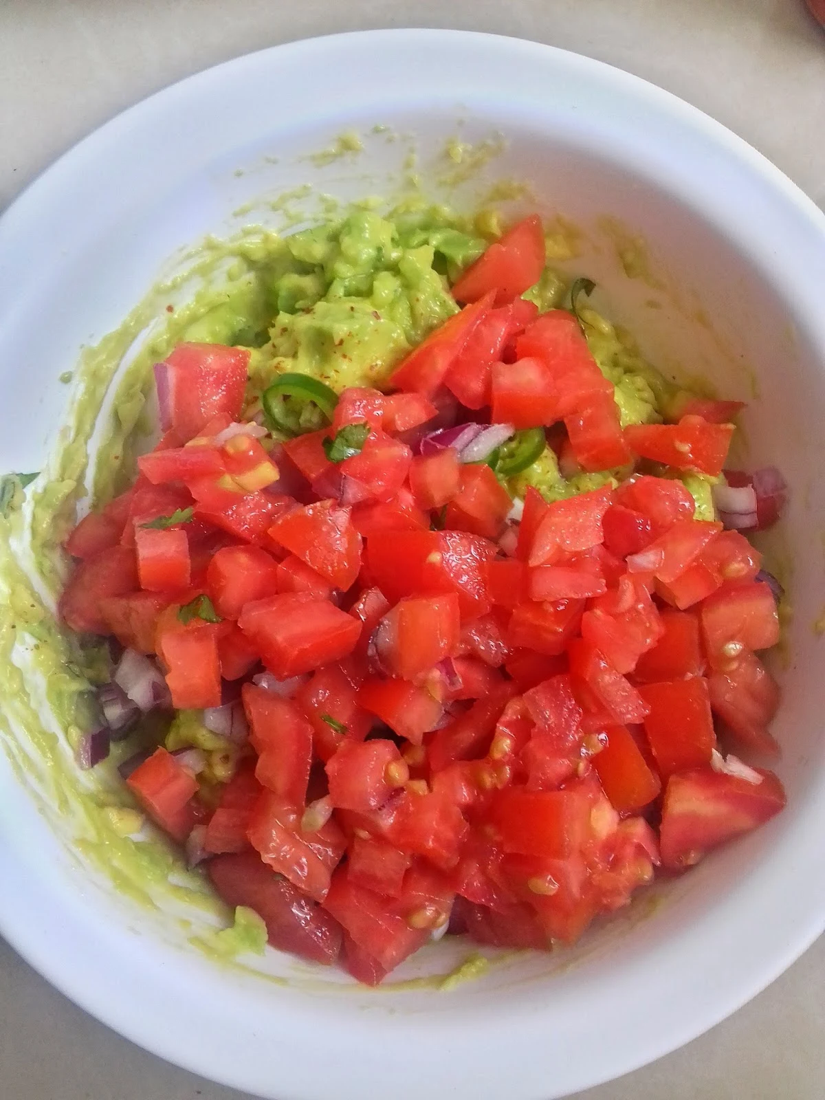jalapeno-peppers-guacamole-nairobi-kitchen-recipe-add-tomatoes-in-bowl