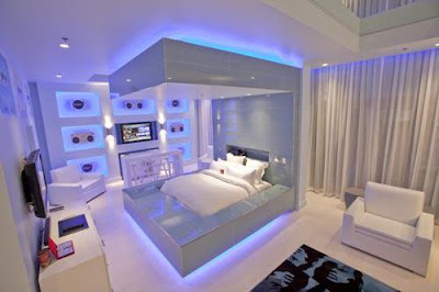 Soft modern bedroom sets with stylish white colors and light blue lighting under bed and overheads