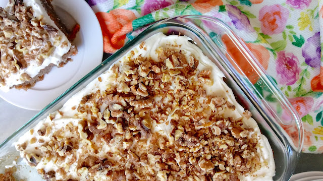 the finished Easy Carrot Cake next to a slice on a plate