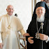 Patriarch Bartholomew gives Pope Francis chocolates