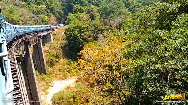 Train moving through bridge and into tunnel in Shiradi Ghats section of Sahyadri - Western Ghats