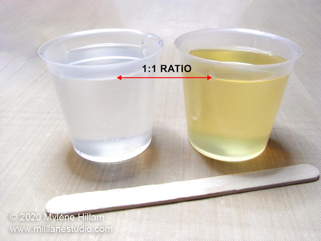 Cups of resin and hardener measured equally in 1:1 ratio