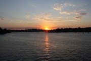 The sun at sunset is reflected across the Parramatta River, viewed from the . (parramatta river sunset)