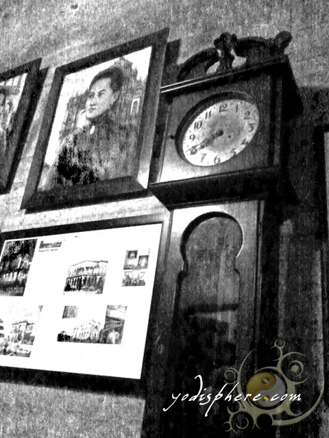 hover_share Old antique clock and old photos displayed inside the Ruins in Talisay City Negros Occidental 