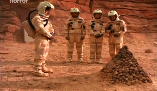 Funeral for one of the five astronauts - Escape from Mars movie image