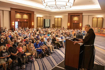 Fr. David addresses "Q" attendees