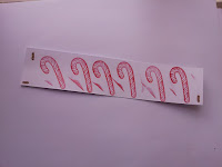 Candy cane stamp in red on white card