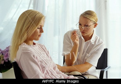 Blond girl undergoing hypnotherapy.