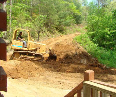 Using a bulldozer to remove stumps