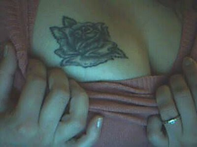 Tattoo On Breast Pictures. Breast Tattoo Design.