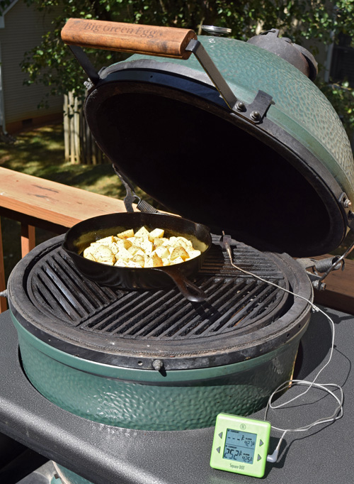 Griswold #8 skillet full of potatoes on a big green egg