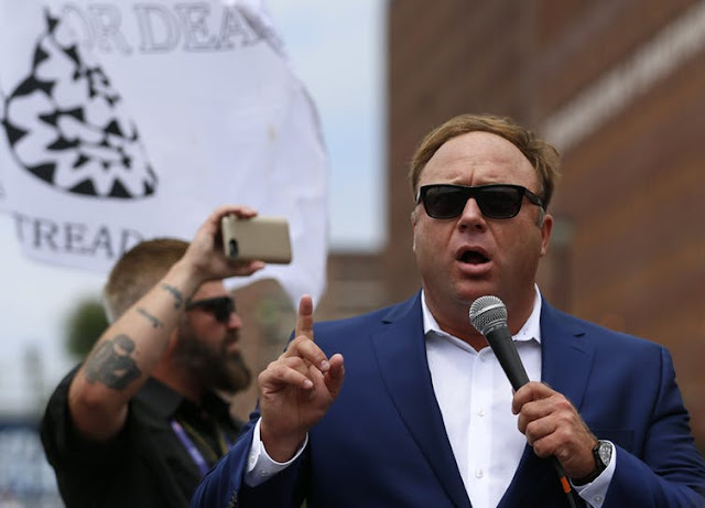 Alex Jones speaks during a political rally.