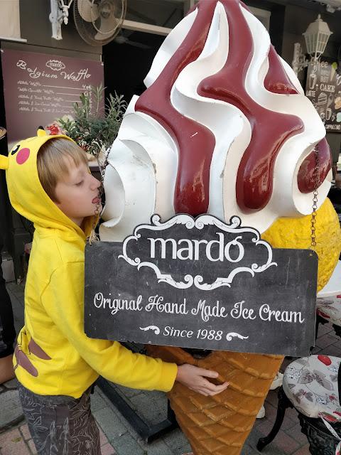 child with giant ice-cream model in Nicosia, Cyprus