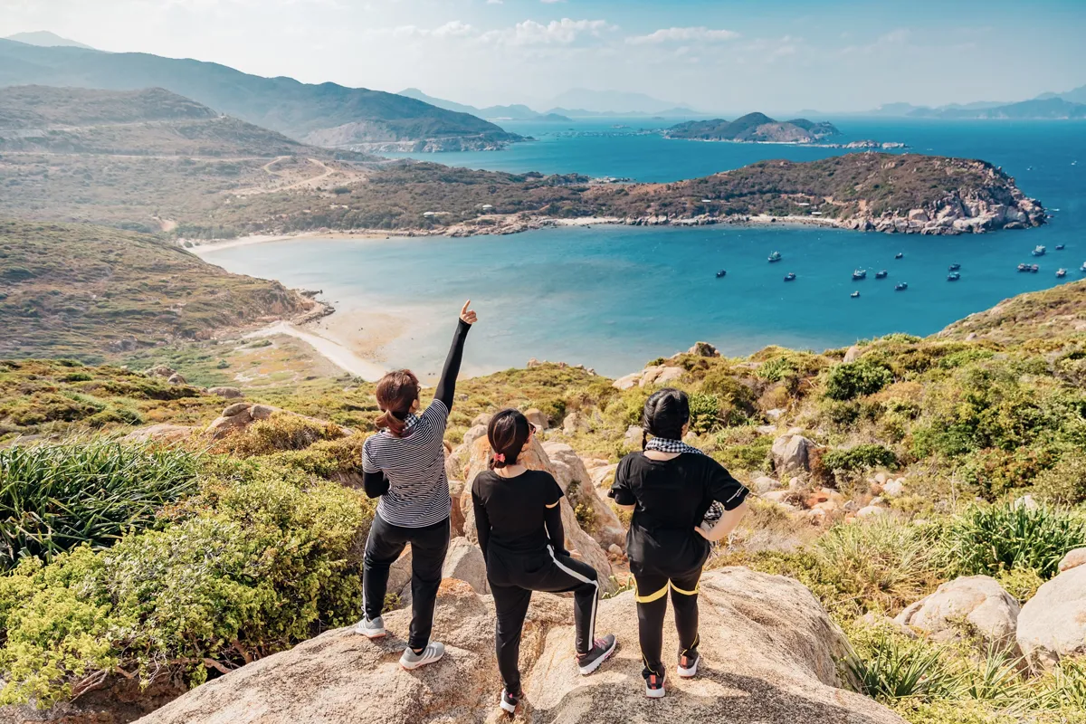 a group of women on top of a hill