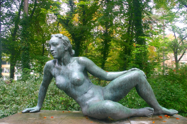   Going for a walk around some common woods area in a regular neighborhood we found art sculpture displayed and even NUDES.