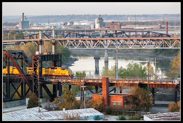 UP 6838 leads a train east on the Highline Bridge at Santa Fe Junction.