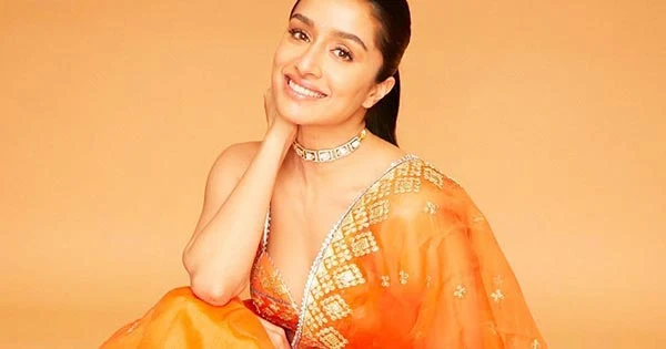 Shraddha Kapoor orange saree cleavage ponytail