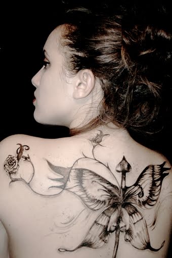 butterfly tattoos on upper back. upper back tattoos.