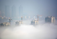 Buildings under construction are seen during a hazy day in Rizhao, Shandong Province, China, March 15, 2016. (Credit: Reuters/Stringer) Click to Enlarge.