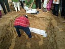 Pages of Ramnaam books being placed in the pit