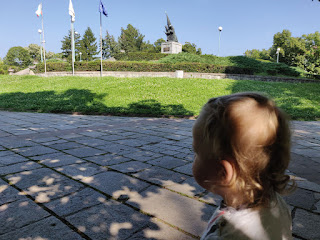 In the shade by a war memorial