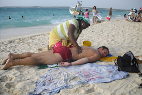 Getting 'rubbed-up' on a beach on Colombia's Caribbean coast by a 'strong-handed' lady. A much safer pursuit than hiring 'escorts'!